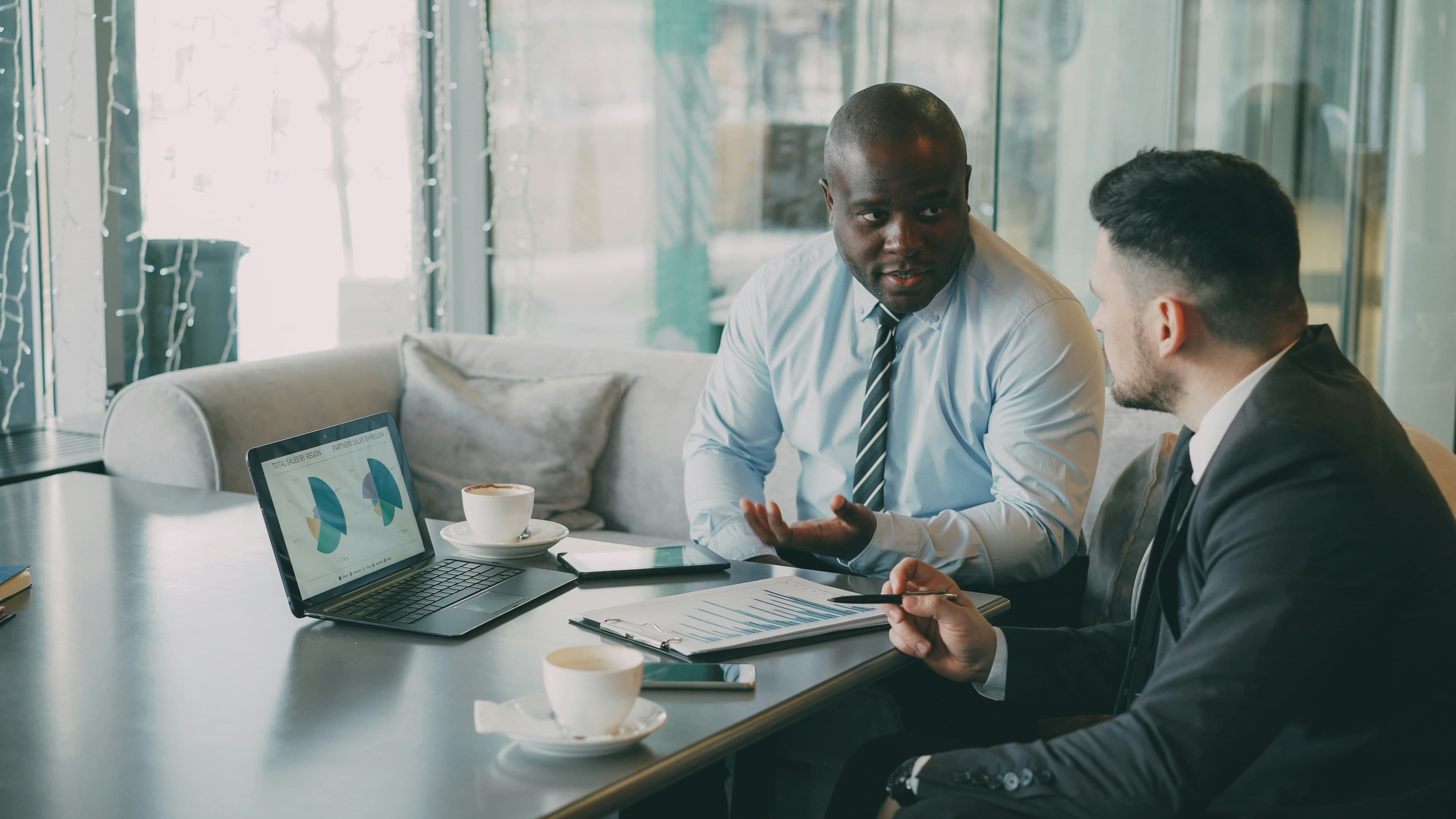 Business owners discussing an acquisition and ownership transition